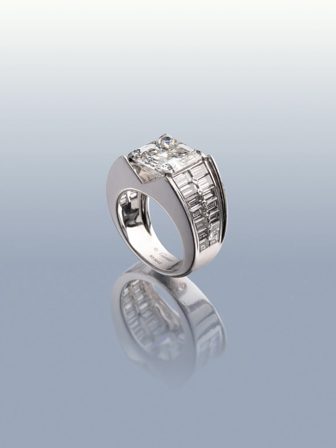 Cartier diamond ring with a 5.37 ct central diamond and baguette-cut diamond shoulders